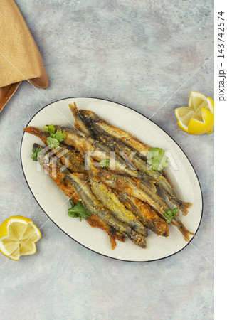 Homemade crispy capelin fish with lemon. 143742574