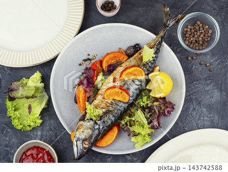 Gourmet baked mackerel with orange and mandarin 143742588