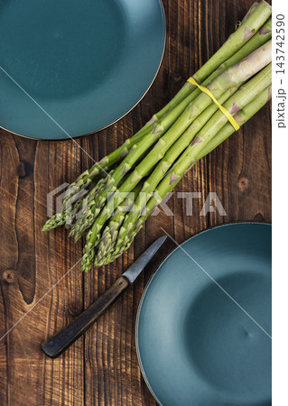 Healthy organic green asparagus for cooking Healthy organic green asparagus for cooking 143742590
