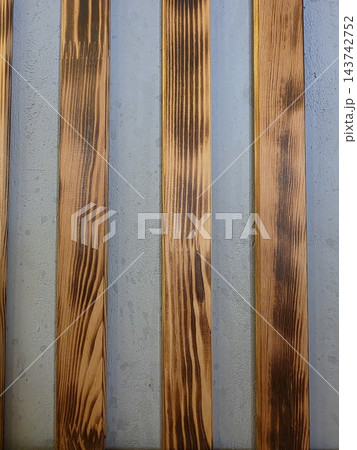 Vertical wooden slats wall paneling texture 143742752
