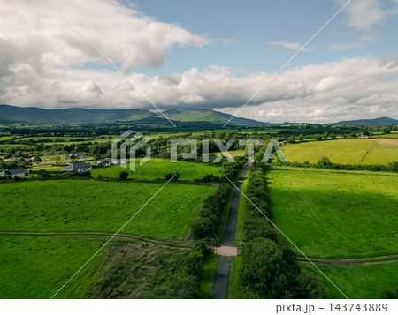 Aerial view of The Waterford Greenway, also known as the Deise Greenway, a scenic cycling and hiking trail following a former railway line through the countryside of County Waterford, Ireland Waterfor Aerial view of The Waterford Greenway, also known as the Deise Greenway, a scenic cycling and hiking trail following a former railway line through the countryside of County Waterford, Ireland Waterfor 143743889