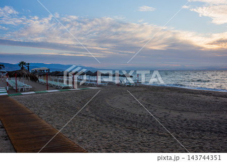 sunrise on the beach with a sunbathing bed in Spain, Almeria 143744351
