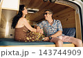 Mature couple enjoying van life adventure together 143744909