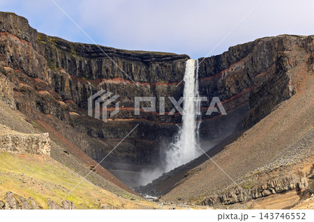 Hengifoss waterfall and red sedimentary layers in the cliffs of East Iceland Hengifoss waterfall and red sedimentary layers in the cliffs of East Iceland 143746552