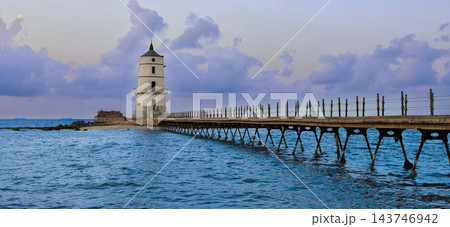 Alexandria Egypt Lighthouse and Mediterranean Sea at Sunset, Peaceful Seascape with Historic Pier, Magical Clouds, Amazing Sky, Solitude, Calm Alexandria Egypt Lighthouse and Mediterranean Sea at Sunset, Peaceful Seascape with Historic Pier, Magical Clouds, Amazing Sky, Solitude, Calm 143746942