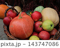 Autumn Harvest Still Life with Pumpkins, Apples and Squash. Rural market stand with fresh vegetables and fruits. Healthy food background. Pumpkin, apples, cabbage and squash in basket. October harvest 143747086