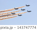 夕日に赤く染まるスモークを曳くブルーインパルス 143747774
