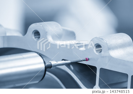 Multi-axis CMM machine measuring aluminum parts with a touch probe in a blue tone scene Multi-axis CMM machine measuring aluminum parts with a touch probe in a blue tone scene 143748515