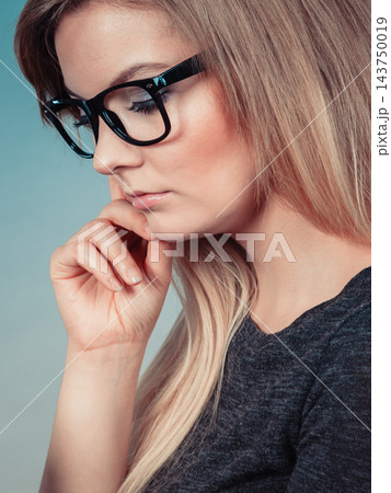 Closeup of woman thinking face expression 143750019