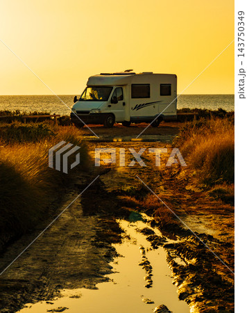 Camper car on beach at sunrise 143750349