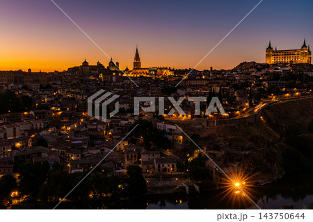 Illuminated Toledo Skyline at Dusk with Starburst Light 143750644