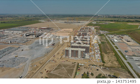 Industrial construction site with construction equipment and materials Industrial construction site with construction equipment and materials 143751495