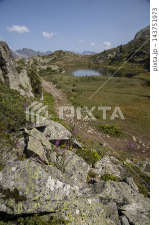 French alps mountain lake and hiking trail 143751973