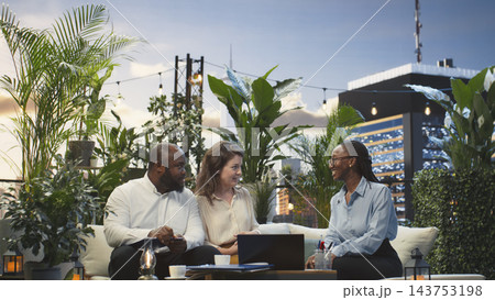 Cheerful business partners shaking hands during meeting on rooftop workspace. Businesspeople doing handshake, excited to start working together on finalizing deal Cheerful business partners shaking hands during meeting on rooftop workspace. Businesspeople doing handshake, excited to start working together on finalizing deal 143753198