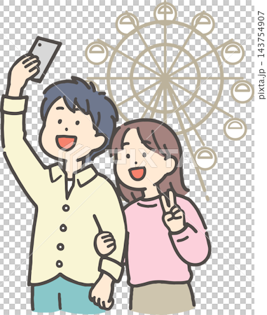 A young couple taking a selfie in front of a Ferris wheel. A young couple taking a selfie in front of a Ferris wheel. 143754907