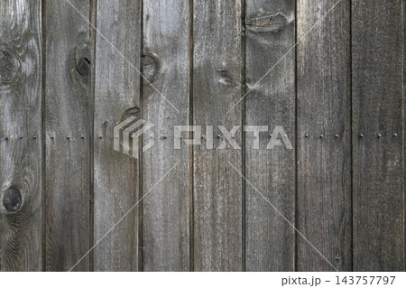 Vertical Weathered Wooden Plank Wall Texture with Natural Knots and Nails 143757797