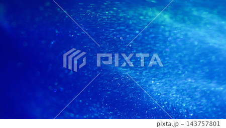 Blur shimmer dust. Shiny texture. Defocused blue neon color radiant illuminated optical flash floating on abstract bokeh light background. 143757801