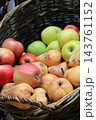 Autumn Harvest Still Life with Apples and Pears. Rural market stand with fresh fruits in wicker basket. Healthy food background. Juicy apples and pears in garden. October harvest. Fall harvest. 143761152