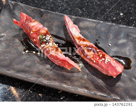Raw Wagyu Beef nigiri Slices with Glaze Raw Wagyu Beef nigiri Slices with Glaze 143762291