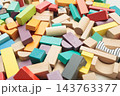 Colorful wooden building blocks scattered on white background for early childhood education 143763377