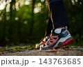 Close up of hiking shoes on forest trail 143763685