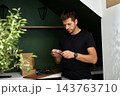 Man inspecting LED strip before installation 143763710