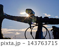 Bicycle headlight and reflector on handlebar in sunlight 143763715