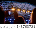 Concert stage lights above crowd at night 143763721