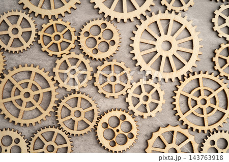 Interlocking wooden gears symbolize teamwork in business. 143763918