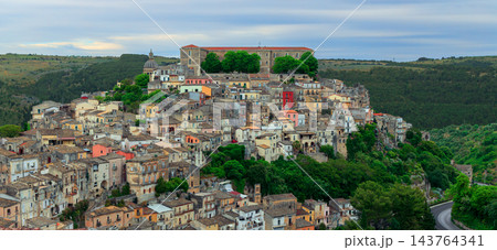 Top panoramic view Ragusa historic hilltop houses above Sicilian valley famous travel check point wanderlust Top panoramic view Ragusa historic hilltop houses above Sicilian valley famous travel check point wanderlust 143764341