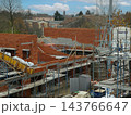 Construction worker laying bricks on building site 143766647