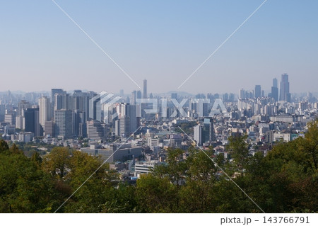 Famous N Seoul Tower landmark and urban skyline view from Namsan Mountain Famous N Seoul Tower landmark and urban skyline view from Namsan Mountain 143766791