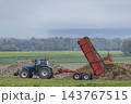 Tractor trailer dumping sugar beets during harvest in Marne, France 143767515