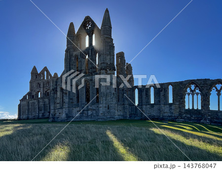 Medieval ruins of Whitby Abbey in the coastal town of Whitby on the North Yorkshire, England 143768047