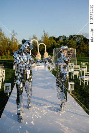 Mirror performers walking down a wedding aisle 143771119