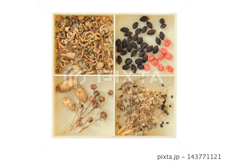 Dry seeds of plants: calendula, rue, peas and others. Top view. Variety of seeds for cottage garden in box isolated on white background. Floral gardening. Dry seeds of plants: calendula, rue, peas and others. Top view. Variety of seeds for cottage garden in box isolated on white background. Floral gardening. 143771121