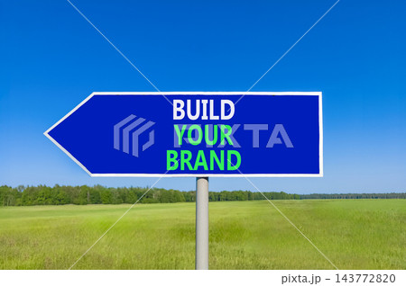 Build your brand words symbol. Concept words Build your brand on beautiful blue road sign. Beautiful blue sky green grass background. Business and build your brand concept. Copy space. Build your brand words symbol. Concept words Build your brand on beautiful blue road sign. Beautiful blue sky green grass background. Business and build your brand concept. Copy space. 143772820