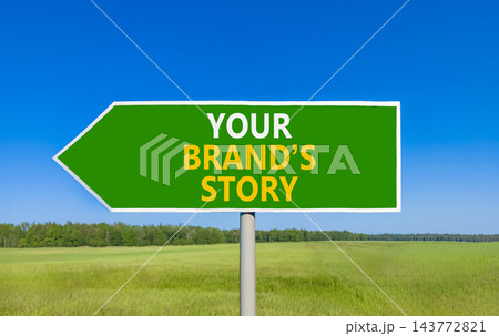 Branding and your brands story symbol. Concept words Your brands story on beautiful green road sign. Beautiful blue sky green grass background. Business branding your brands story concept. Copy space 143772821