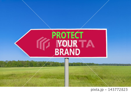 Protect your brand words symbol. Concept words Protect your brand on beautiful red road sign. Beautiful blue sky green grass background. Business and protect your brand concept. Copy space. Protect your brand words symbol. Concept words Protect your brand on beautiful red road sign. Beautiful blue sky green grass background. Business and protect your brand concept. Copy space. 143772823