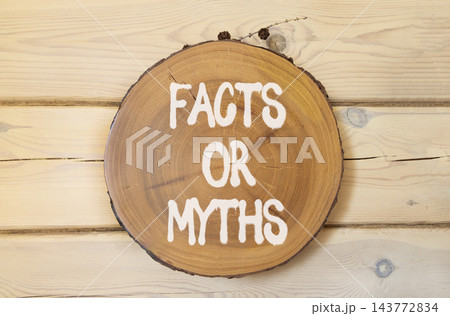 Facts or myths words symbol. Concept words Myths or Facts on beautiful wooden circle. Beautiful wooden wall background. Business and facts or myths concept. Copy space. Facts or myths words symbol. Concept words Myths or Facts on beautiful wooden circle. Beautiful wooden wall background. Business and facts or myths concept. Copy space. 143772834