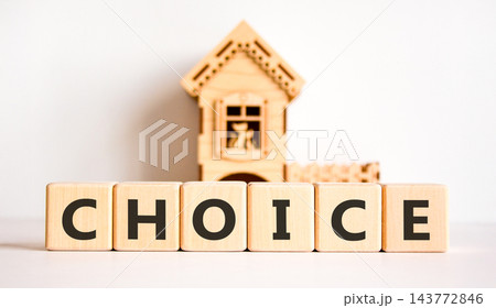 Choice symbol. Concept word Choice on beautiful wooden blocks. Beautiful white background. Beautiful wooden model of house. Business choice concept. Copy space. 143772846