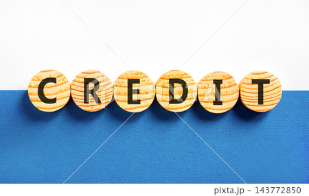 Credit symbol. Concept word Credit on beautiful wooden circles. Beautiful blue and white background. Business credit concept. Copy space. Credit symbol. Concept word Credit on beautiful wooden circles. Beautiful blue and white background. Business credit concept. Copy space. 143772850
