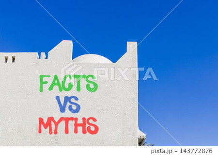 Facts vs versus myths words symbol. Concept words Facts vs Myths on beautiful white wall. Beautiful blue sky background. Business and facts vs versus myths concept. Copy space. Facts vs versus myths words symbol. Concept words Facts vs Myths on beautiful white wall. Beautiful blue sky background. Business and facts vs versus myths concept. Copy space. 143772876