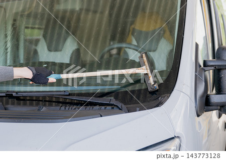 person cleaning motorhome windshield with squeegee during vehicle maintenance and travel preparation person cleaning motorhome windshield with squeegee during vehicle maintenance and travel preparation 143773128