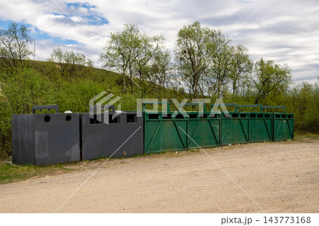 Waste sorting and recycling containers at remote collection point in Finnish Lapland 143773168
