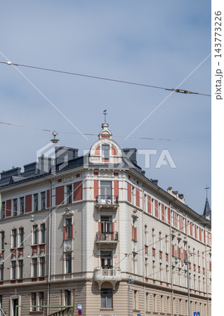 Historic european residential building with ornate facade and balconies on sunny city street in Helsinki Finland Historic european residential building with ornate facade and balconies on sunny city street in Helsinki Finland 143773226
