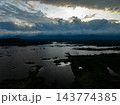 Storm clouds and rain over lake in the morning 143774385
