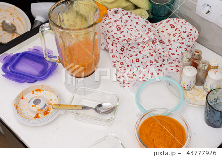 Squash caviar is being prepared on a kitchen counter, with blended squash, a bowl of puree, a blender, and utensils visible during food preparation Squash caviar is being prepared on a kitchen counter, with blended squash, a bowl of puree, a blender, and utensils visible during food preparation 143777926