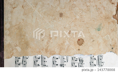 Vintage stained paper texture over sheet music background mockup. High angle view of aged, torn, stained beige paper overlapping sheet music page. Grunge collage background mockup, copy space Vintage stained paper texture over sheet music background mockup. High angle view of aged, torn, stained beige paper overlapping sheet music page. Grunge collage background mockup, copy space 143778008