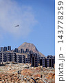 Helicopters flies on construction site of vertically mounted photovoltaic plant, solar panels, future innovation energy concept 143778259